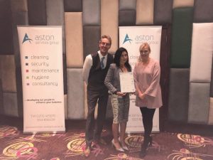 Shows Suzie Roberts of Equals Training and Ian Gilston, Chairman of Aston Services Group, presenting one of the apprentices Nosheen Rhodes with her certificate at the conference